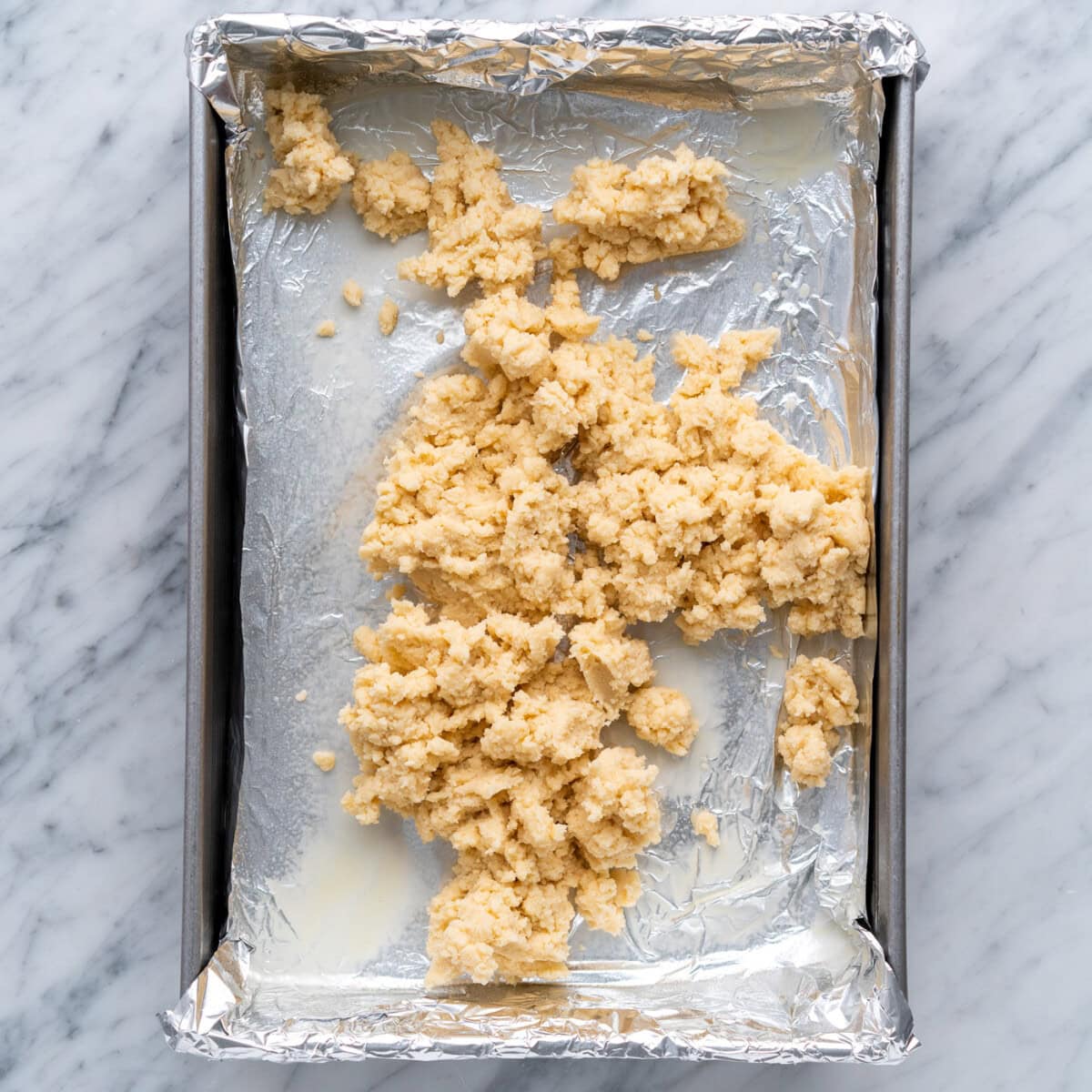 shortbread crust on top of a baking pan