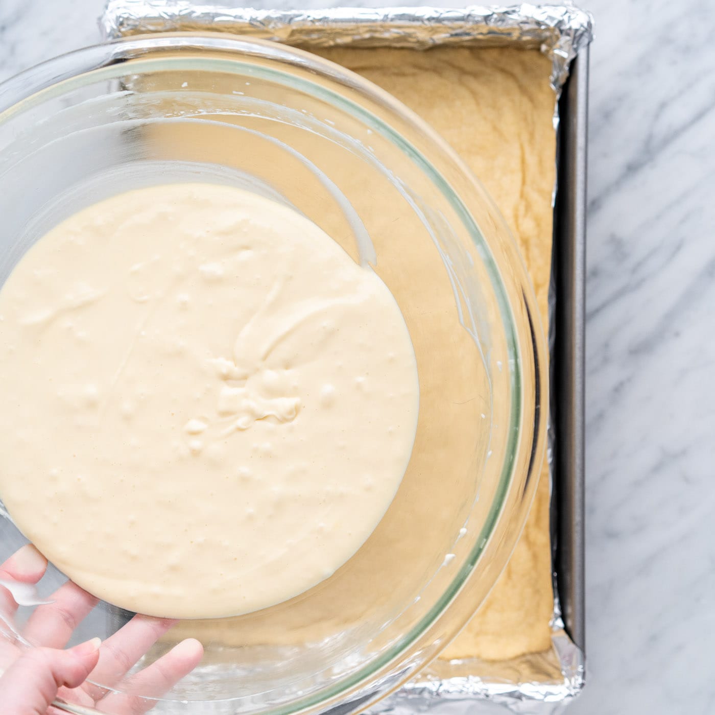 cheesecake mixture over shortbread crust