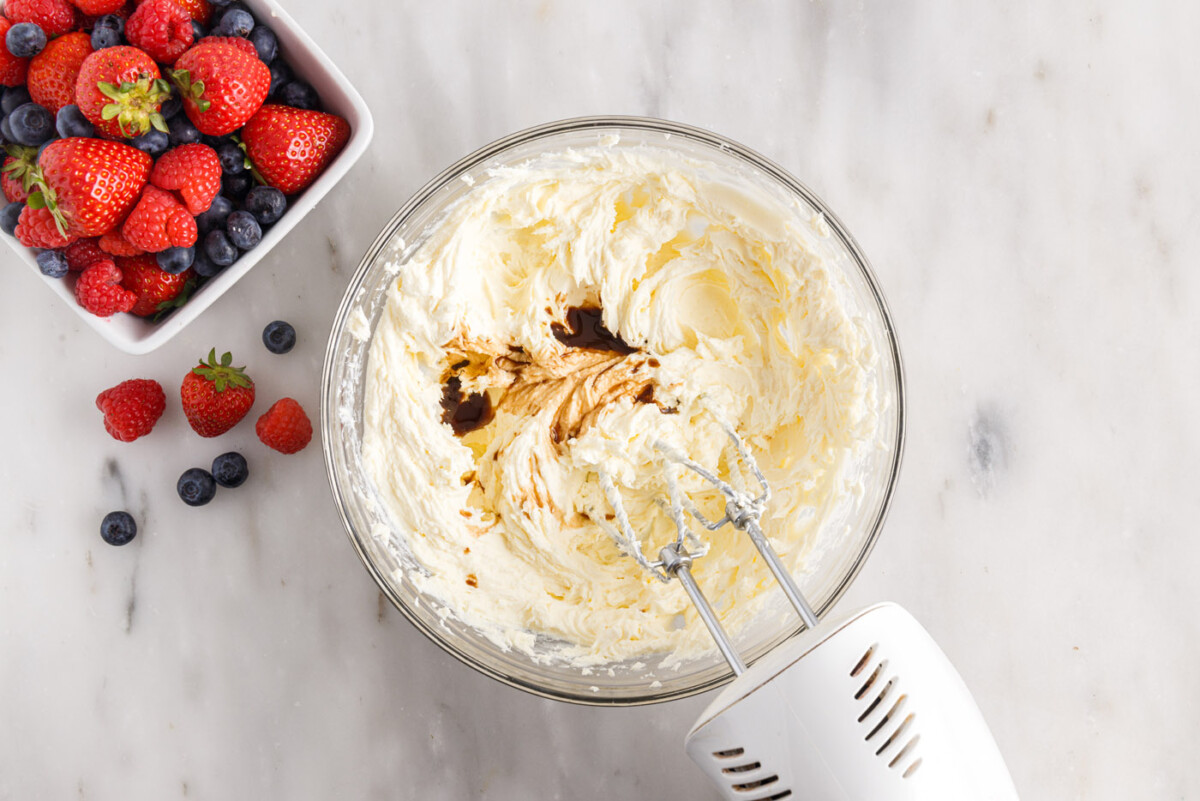 creaming chantilly frosting in a bowl