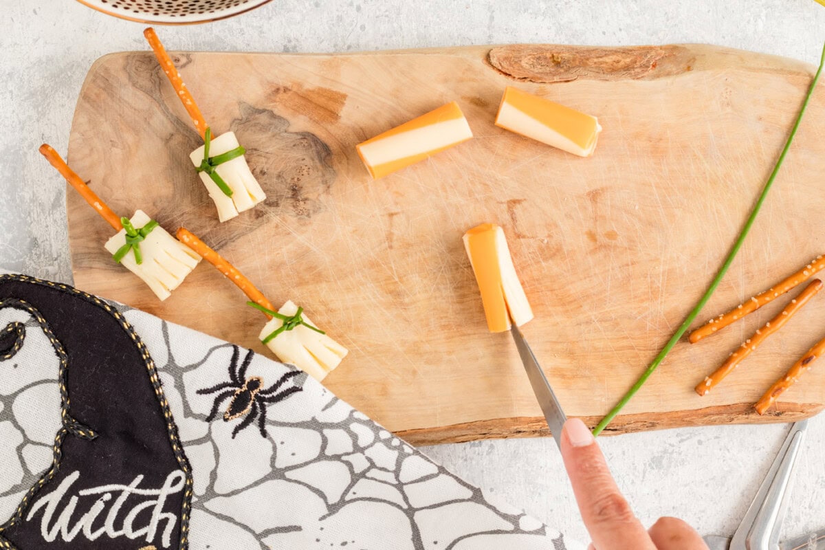 knife slicing cheese stick