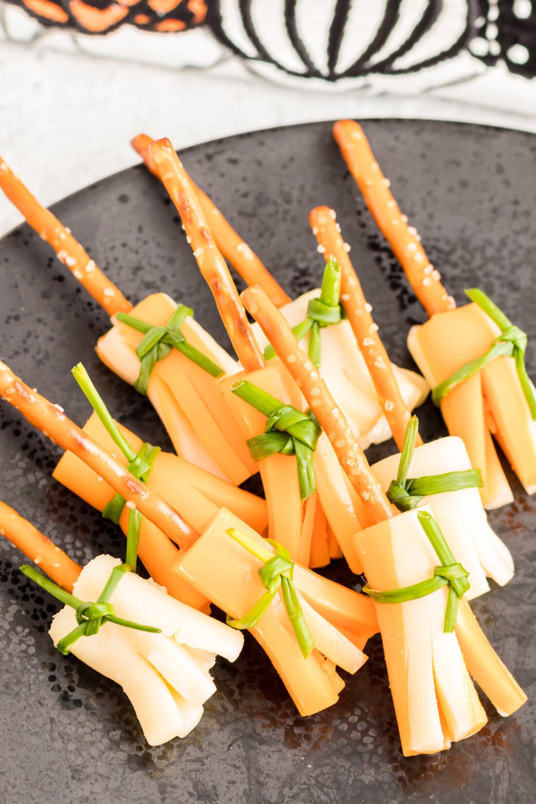 Cheese and Pretzel Broomsticks laying on a plate