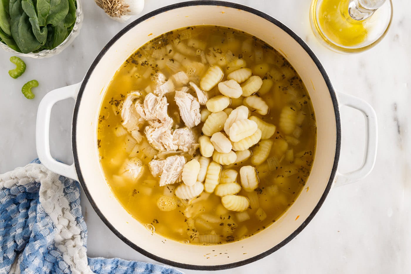 chicken and gnocchi added to soup pot