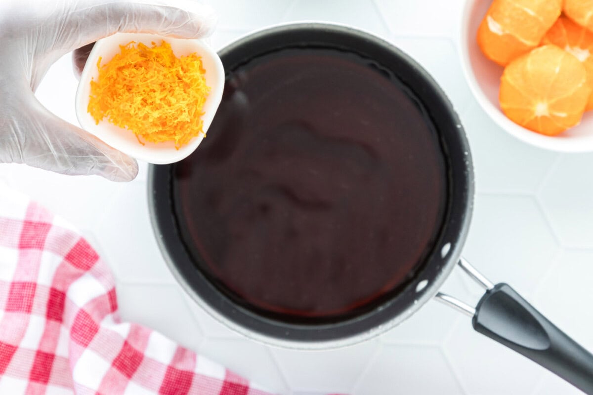 adding clementine zest to soy sauce mixture