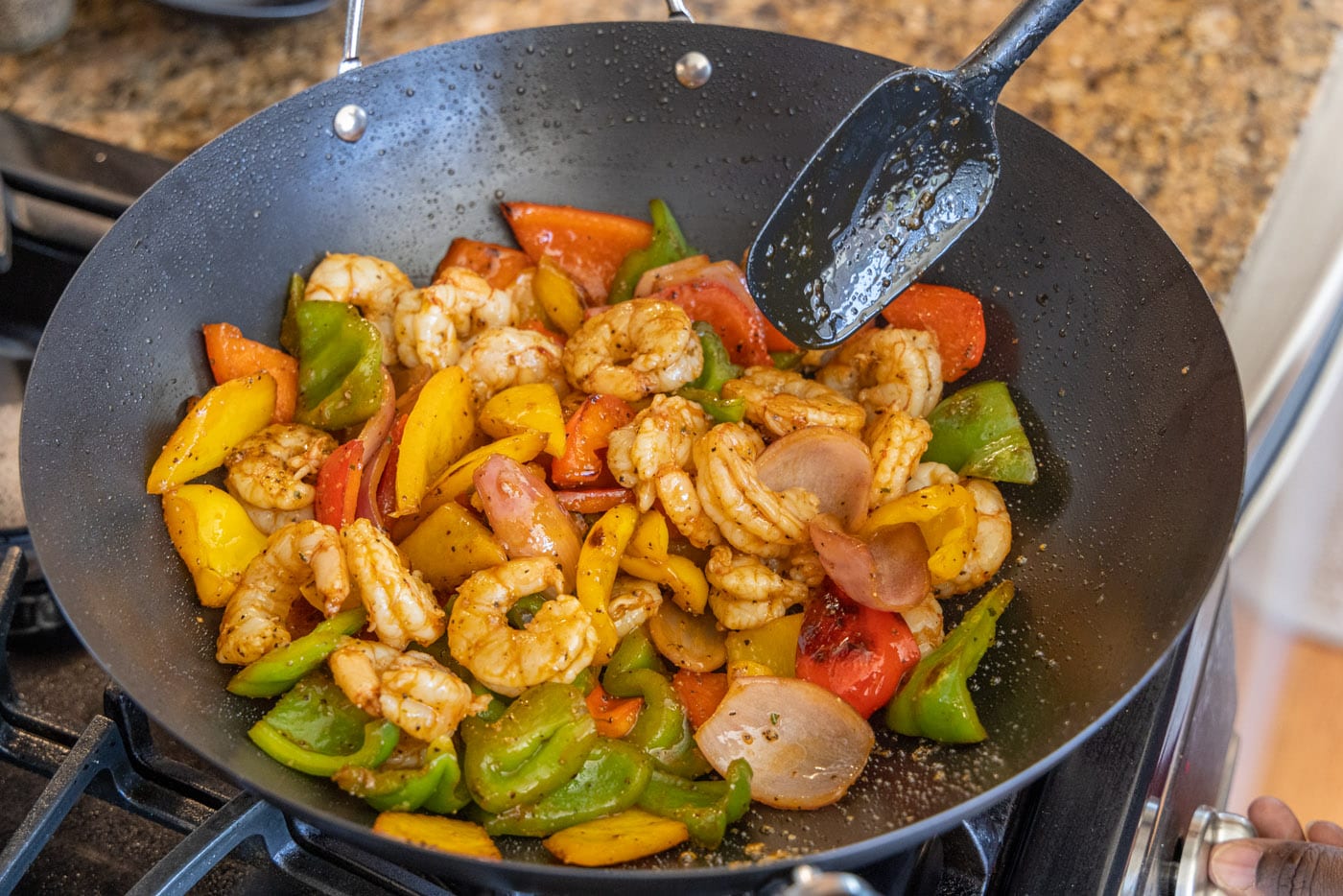 cooked shrimp and veggies in a skillet