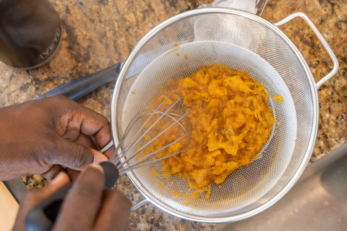 straining clementines from sauce