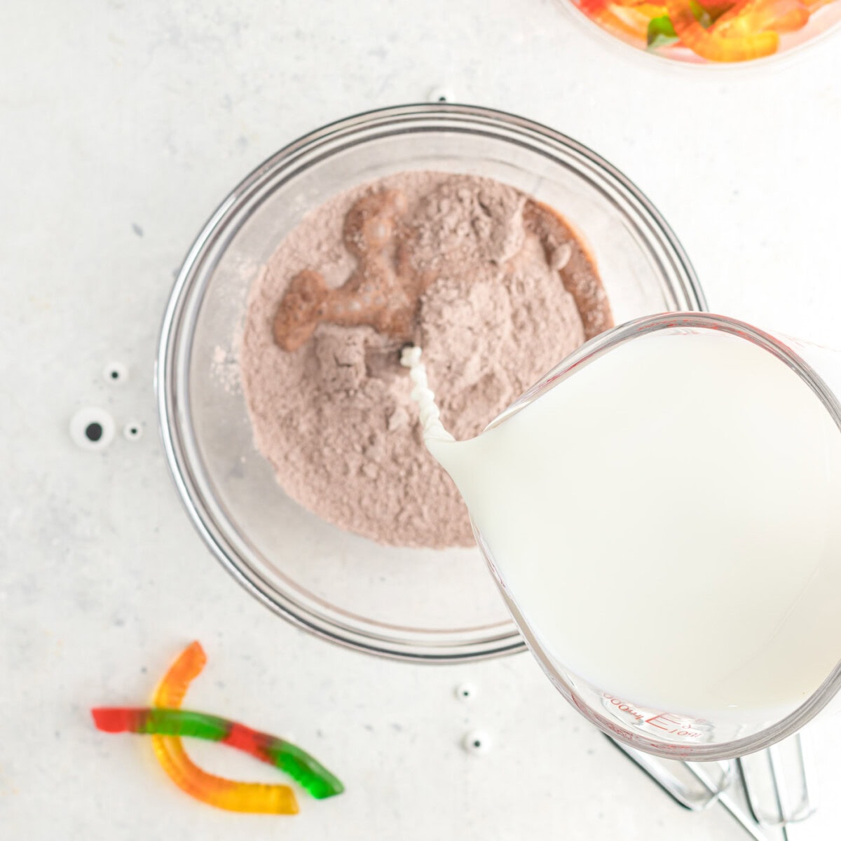 pouring milk into instant chocolate pudding