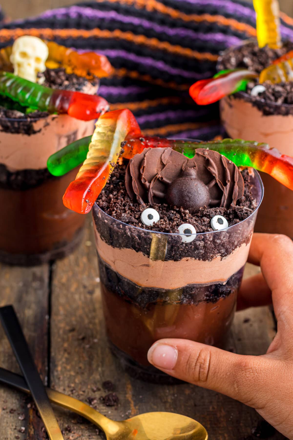 hand grabbing a Halloween Dirt Cup