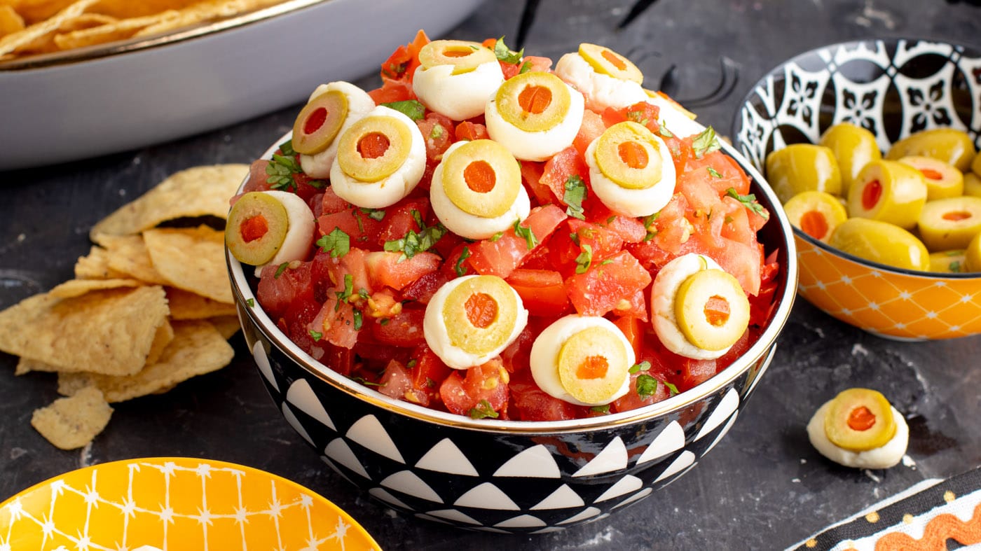 Easy, creepy Halloween eyeball salsa will be the talk of the party! Serve with warm tortilla chips f