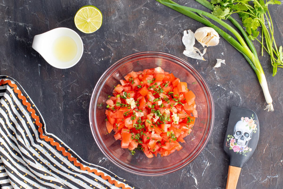 pico de gallo ingredients in a mixing bowl