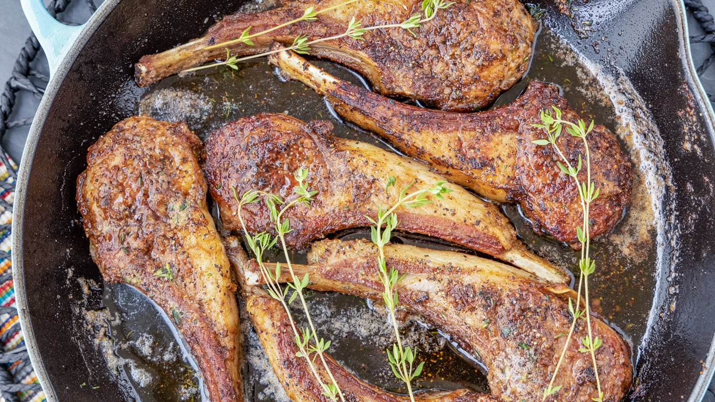 Juicy lollipop lamb chops are pan-seared with a spice rub creating a delicate golden brown crust on 