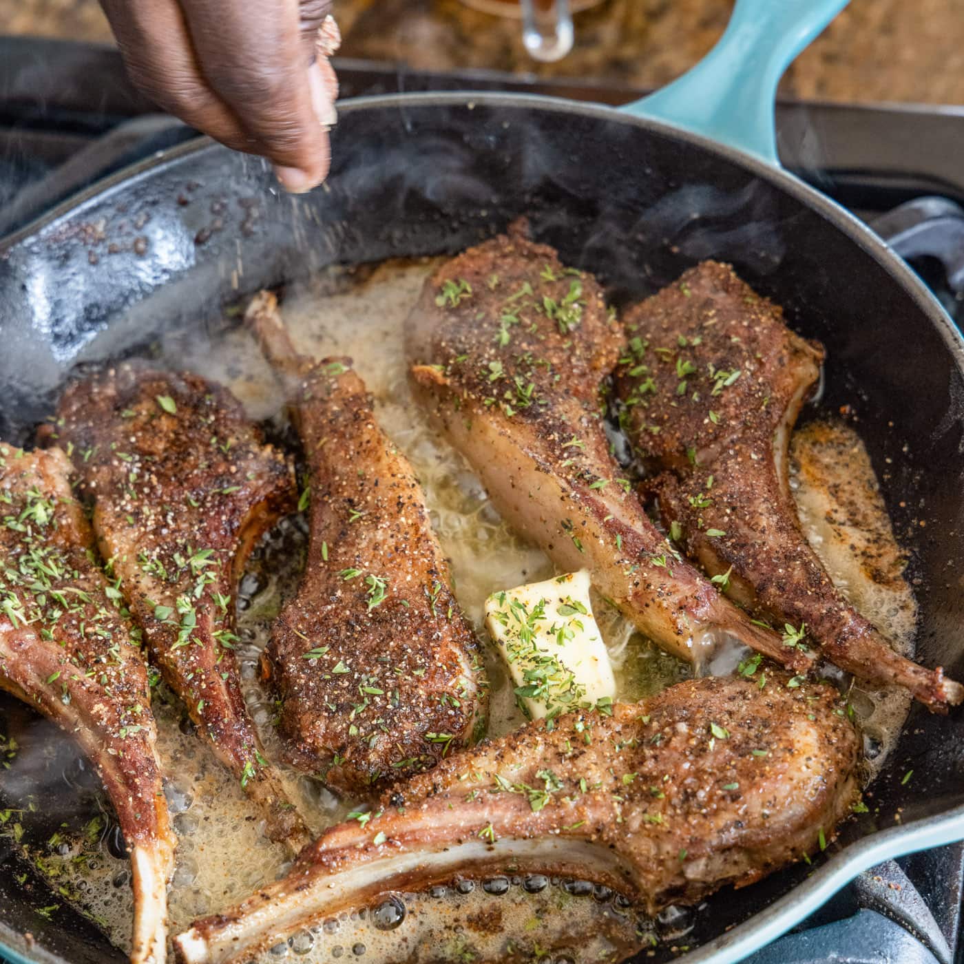 butter and thyme on lamb chops