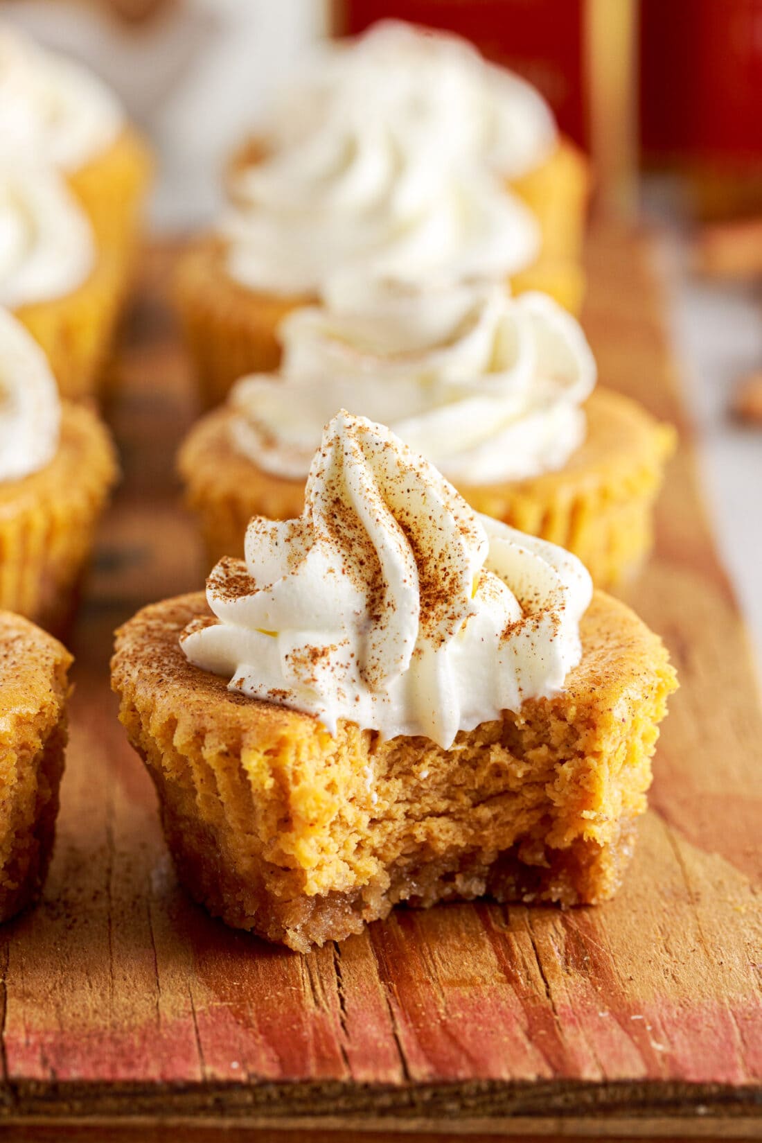 Mini Pumpkin Cheesecake with a bite out of it