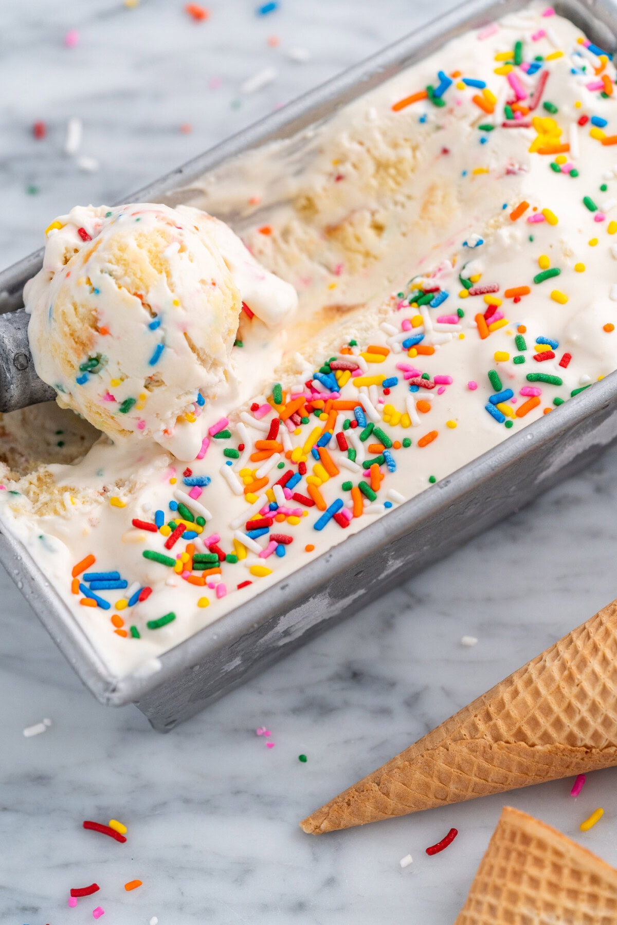 scooping out No Churn Birthday Cake Ice Cream