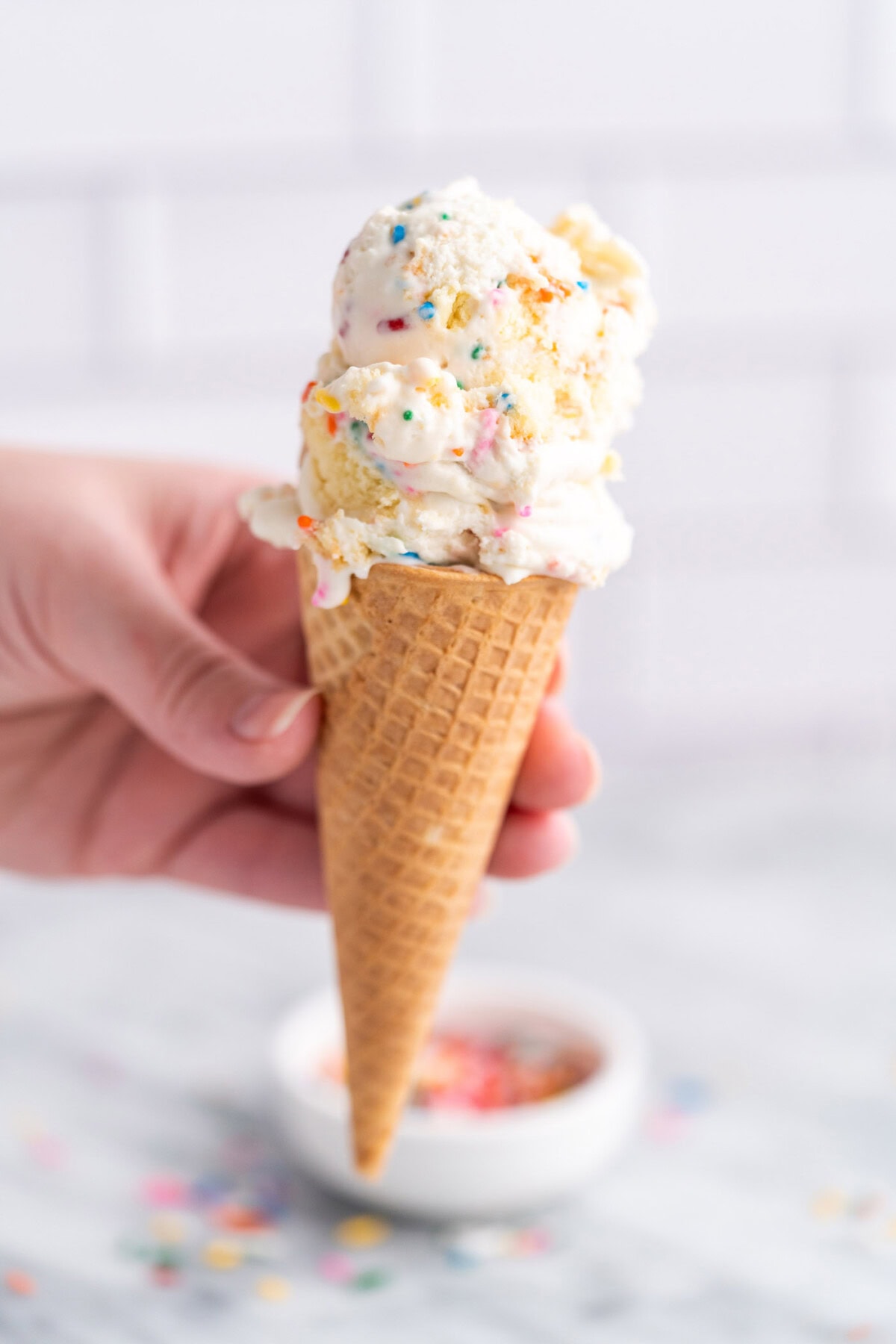 holding ice cream cone