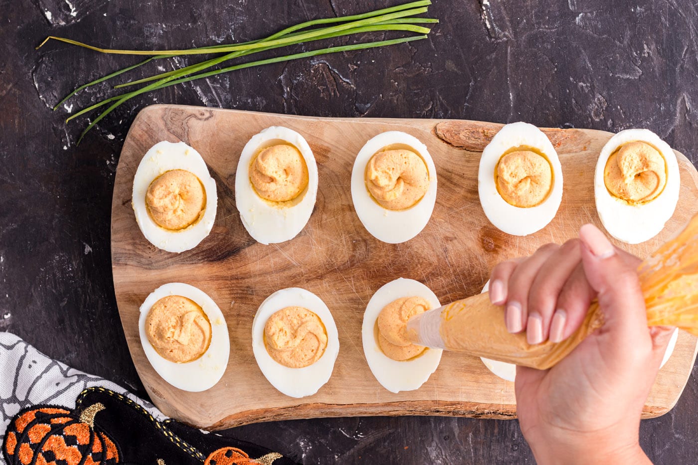 piping eggs with yolk mixture