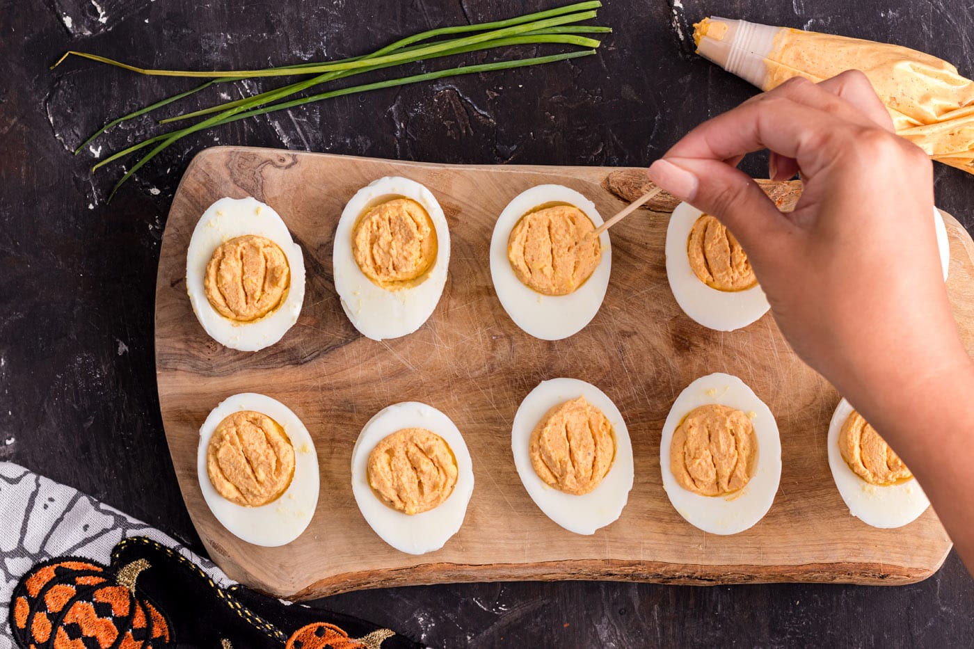 adding ridges with a toothpick to deviled eggs