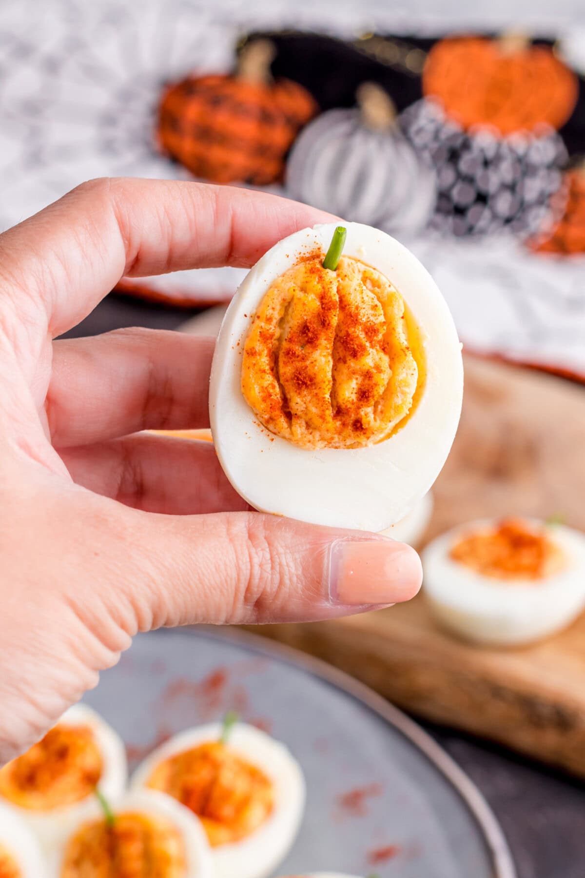 hoolding a Pumpkin Deviled Egg
