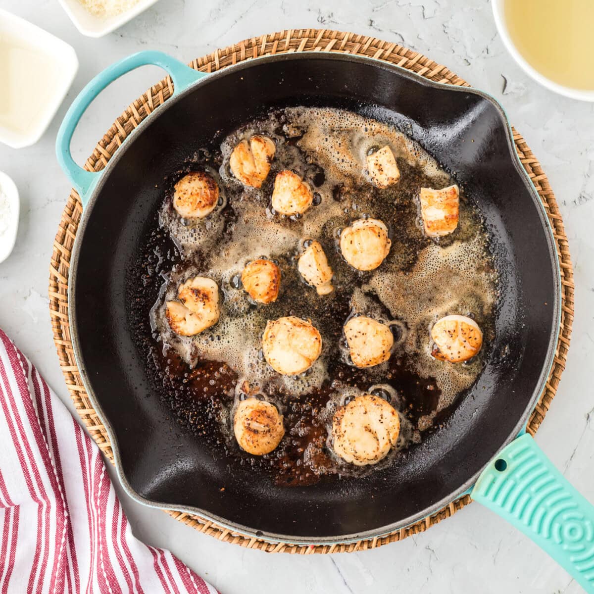 pan seared scallops in a pan with butter