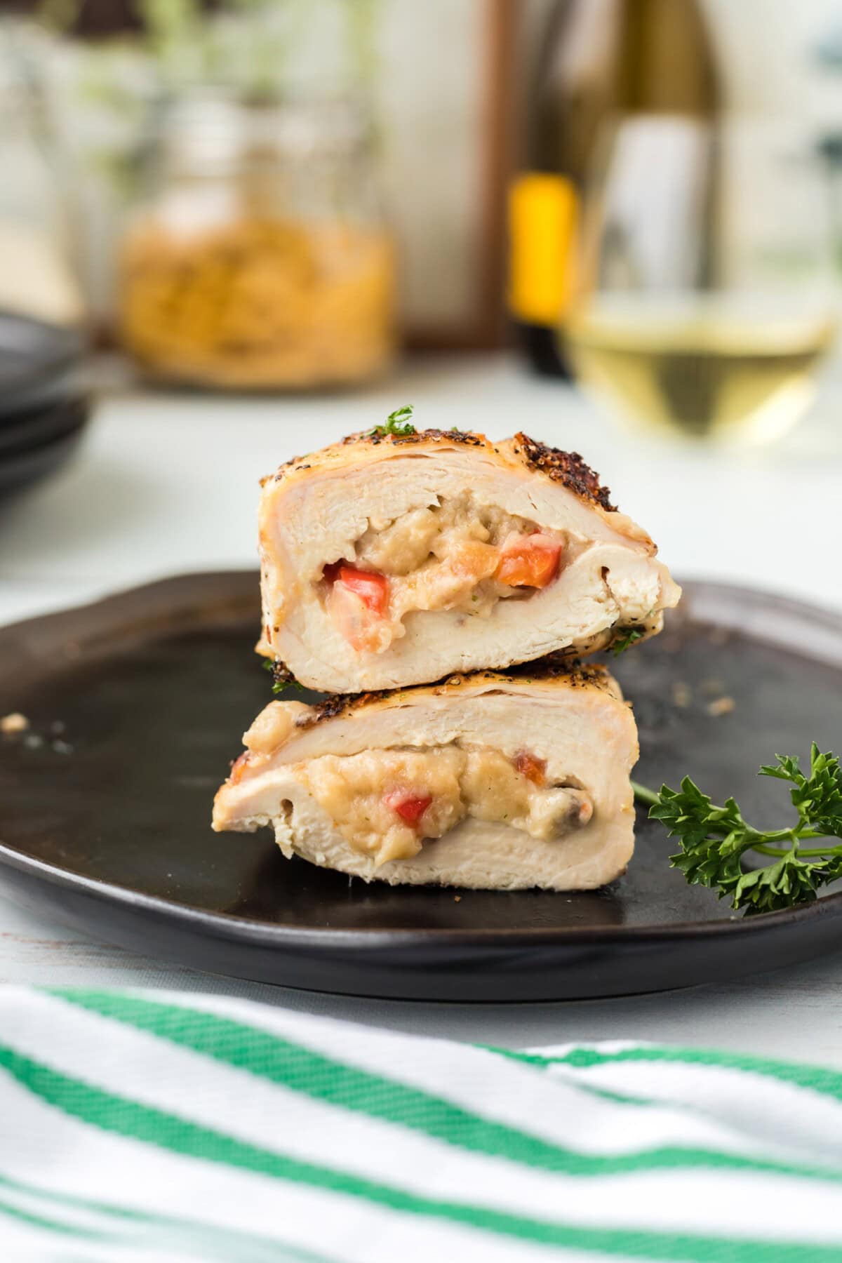 Stuffed Chicken Breast cut in half on plate