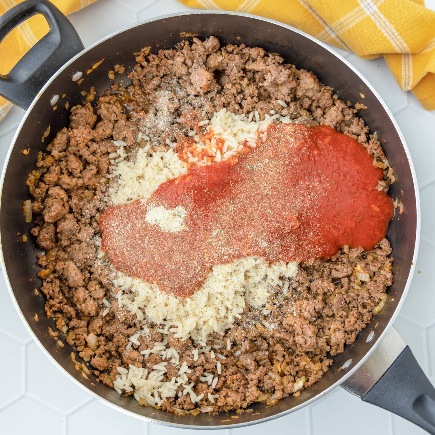 beef mixture with tomato sauce in a skillet