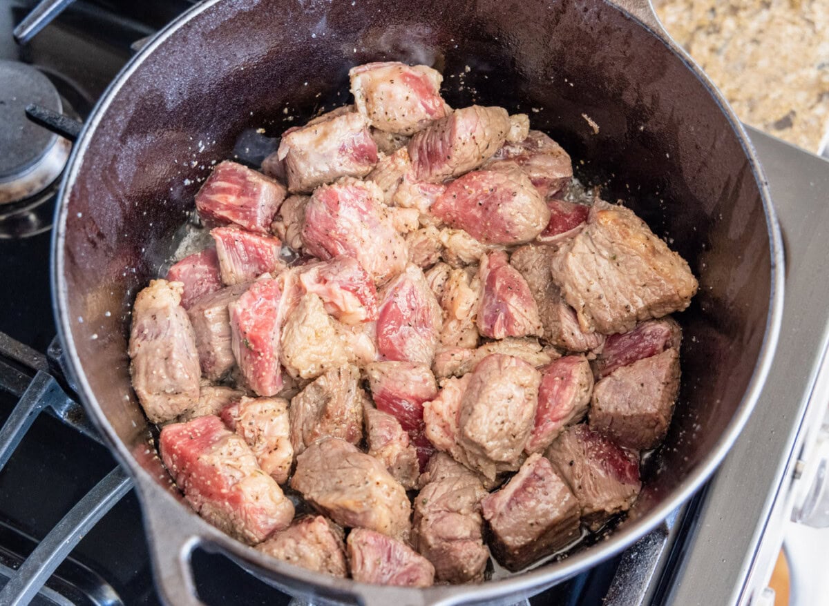 browned beef chuck in a dutch oven