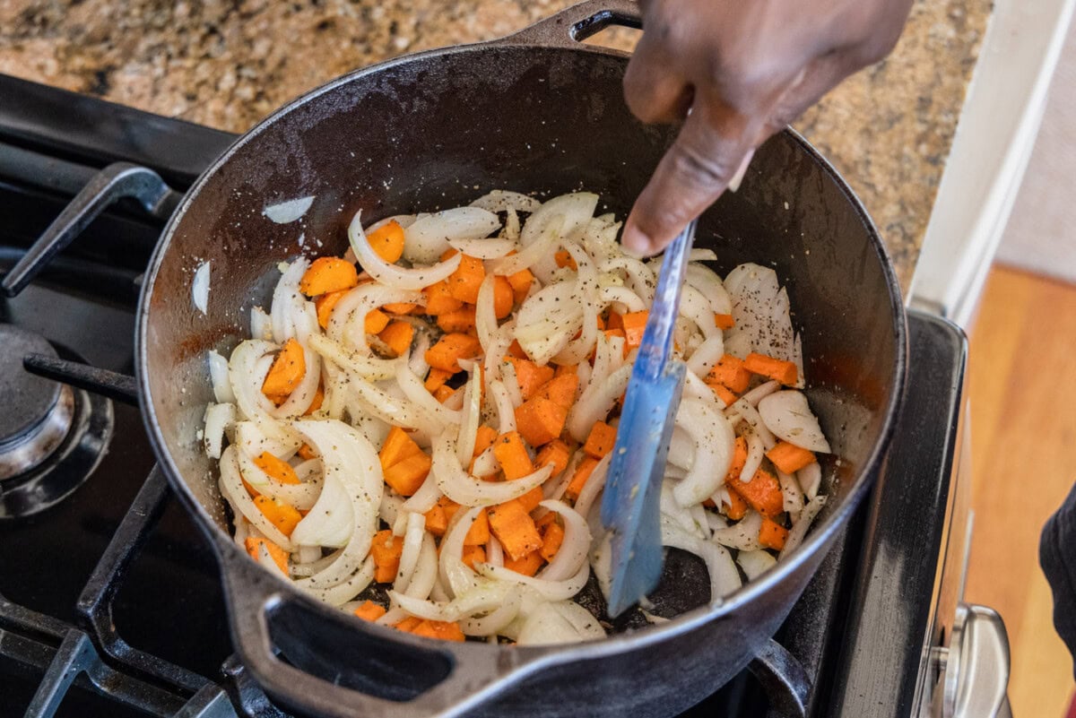 onion, garlic, and carrots in a dutch oven