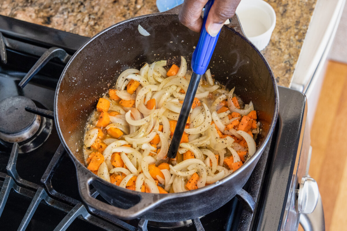 lighting cognac over onions and carrots