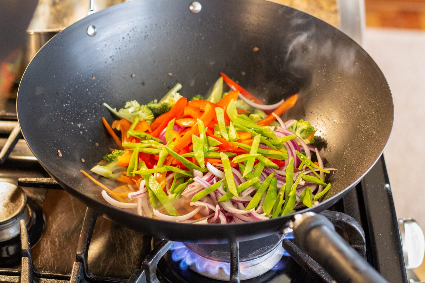 stir fry veggies in a wok