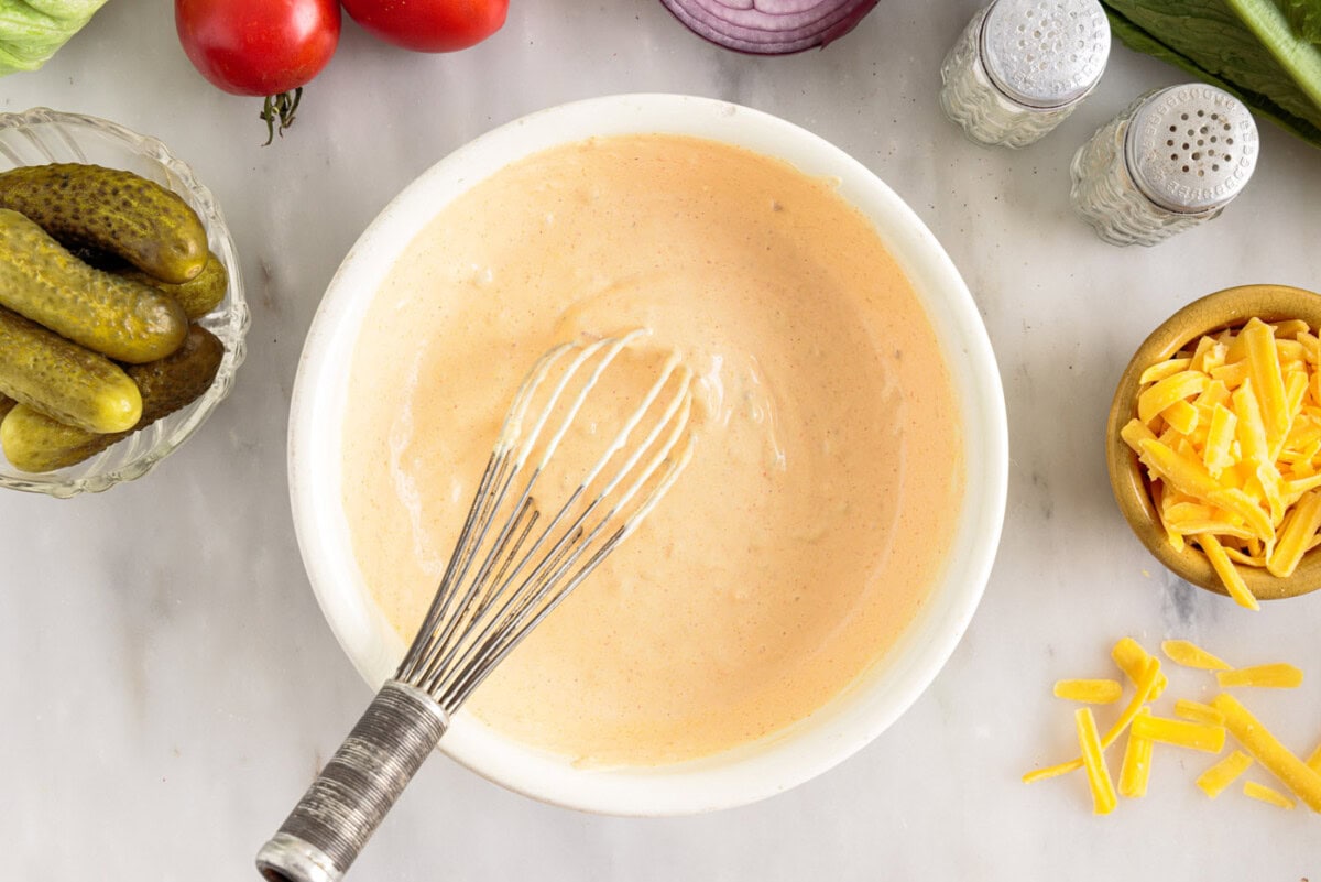 whisking Big Mac sauce in a bowl
