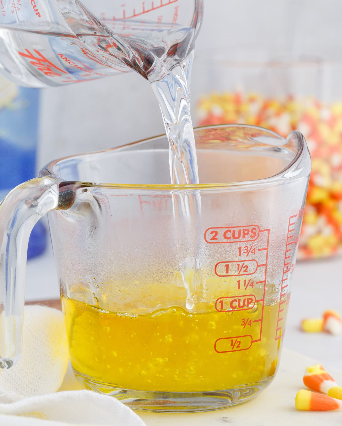 pouring water into lemon jello mix