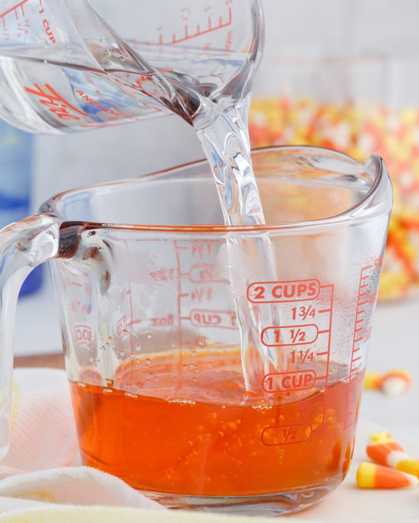 pouring water into orange jello mix