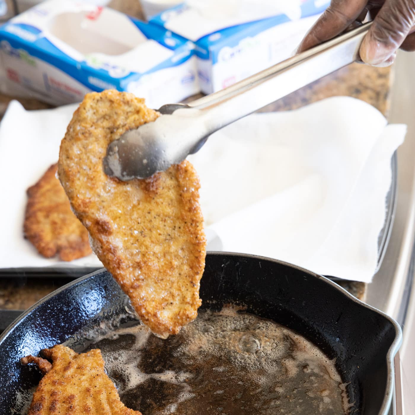 removing chicken milanese from skillet