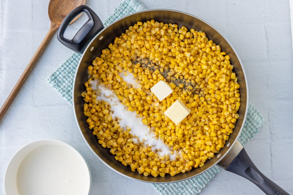 corn, butter, salt, and pepper in a skillet