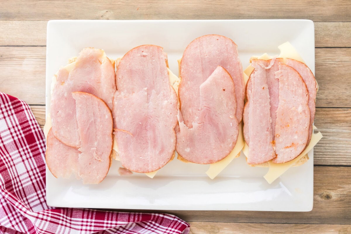 ham on top of Swiss cheese and Cuban bread