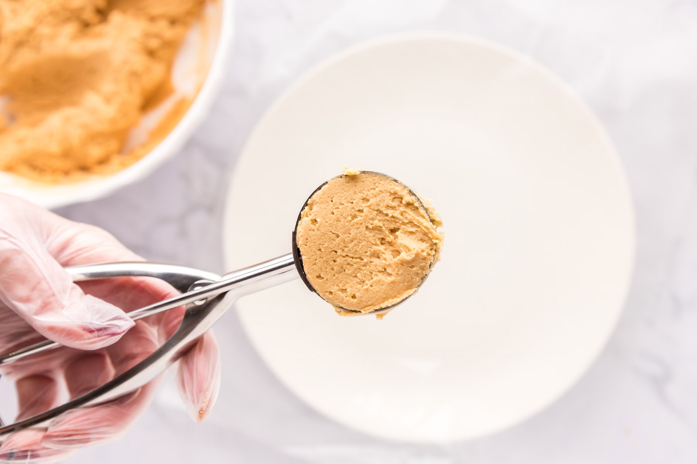 peanut butter cookie dough in a cookie scoop