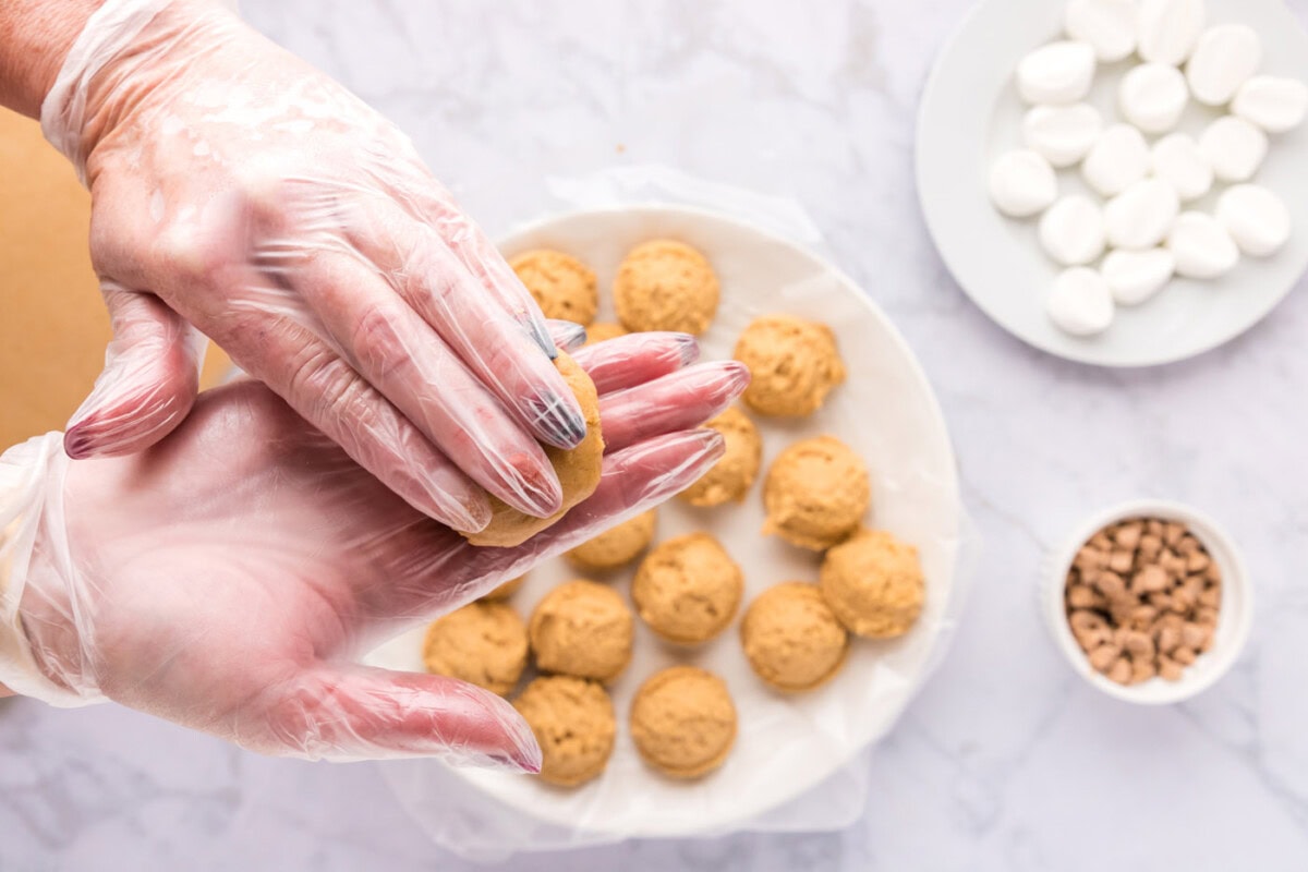flattening peanut butter cookie dough ball