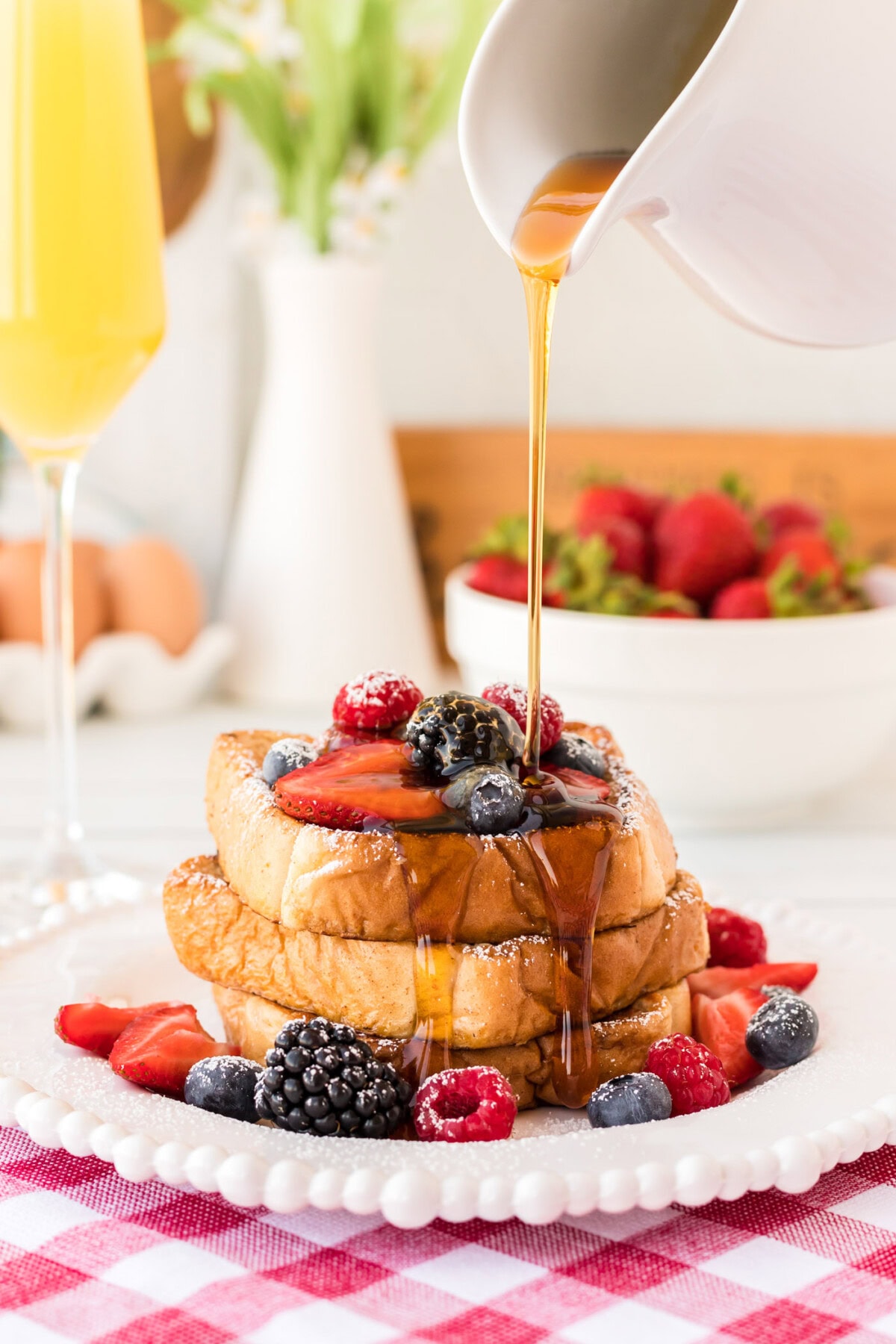 drizzling syrup on French Toast