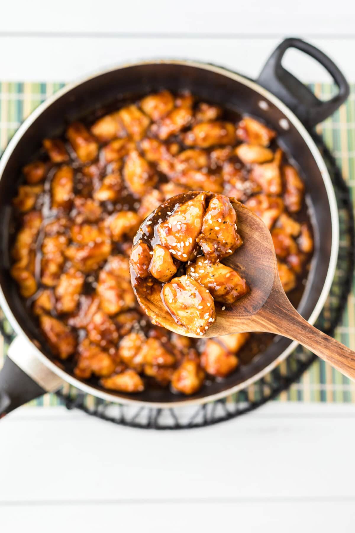 lifting a spoonful of General Tso Chicken