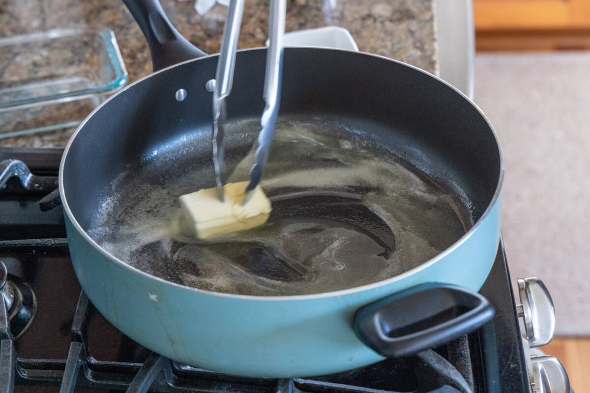 melting butter in a hot skillet