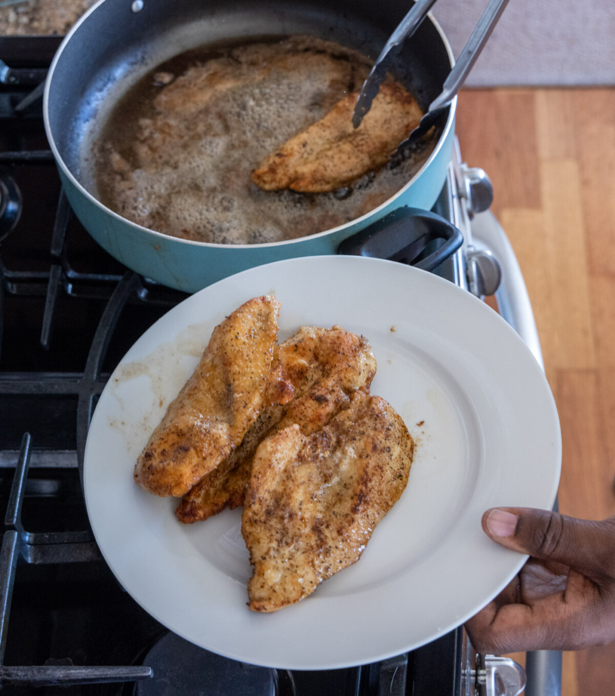 removing chicken breasts to a plate