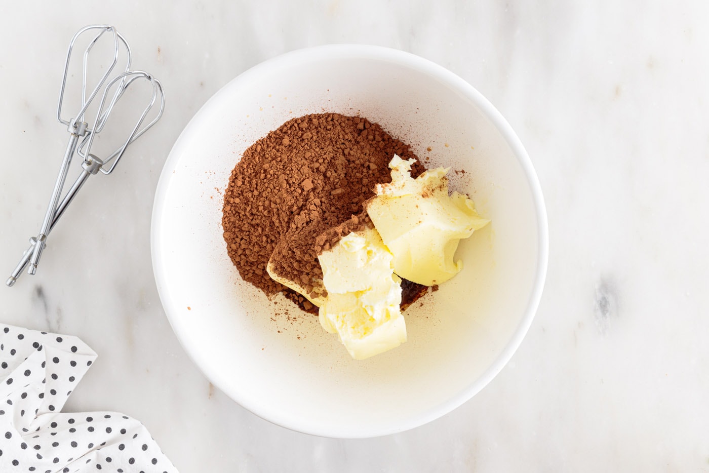 butter and cocoa powder in a mixing bowl