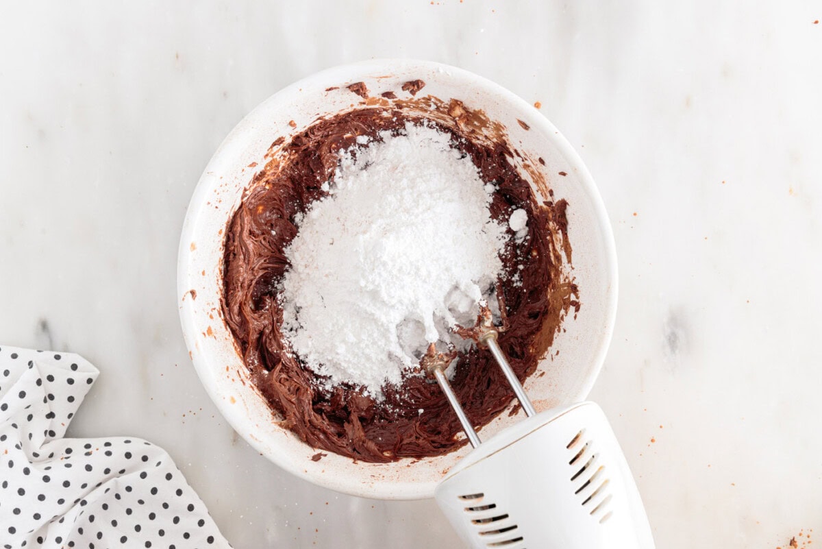 powdered sugar added to chocolate frosting