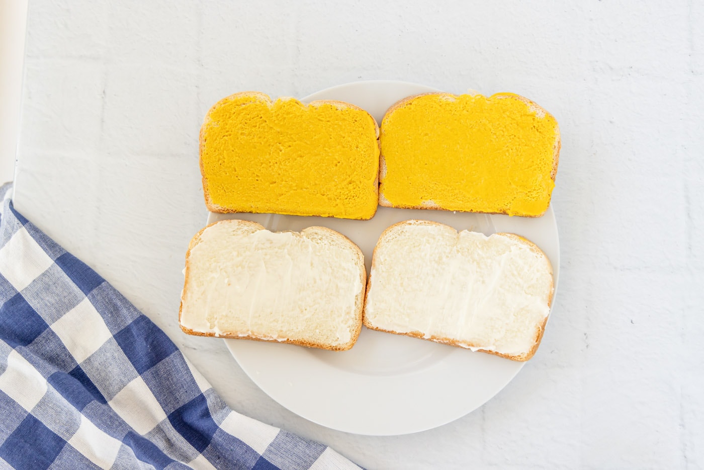 mayo and mustard on sandwich bread