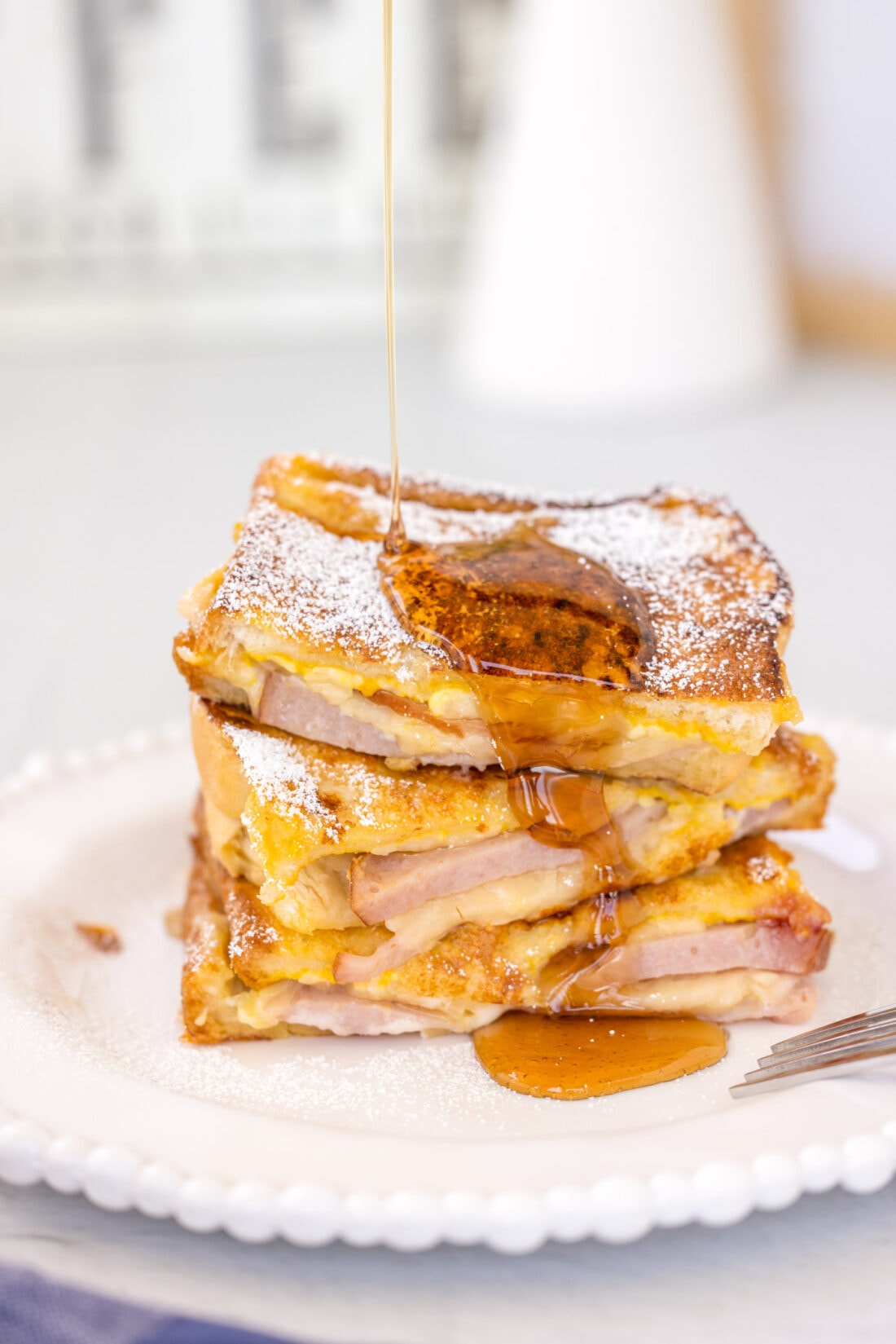 stack of Monte Cristo Sandwich with syrup