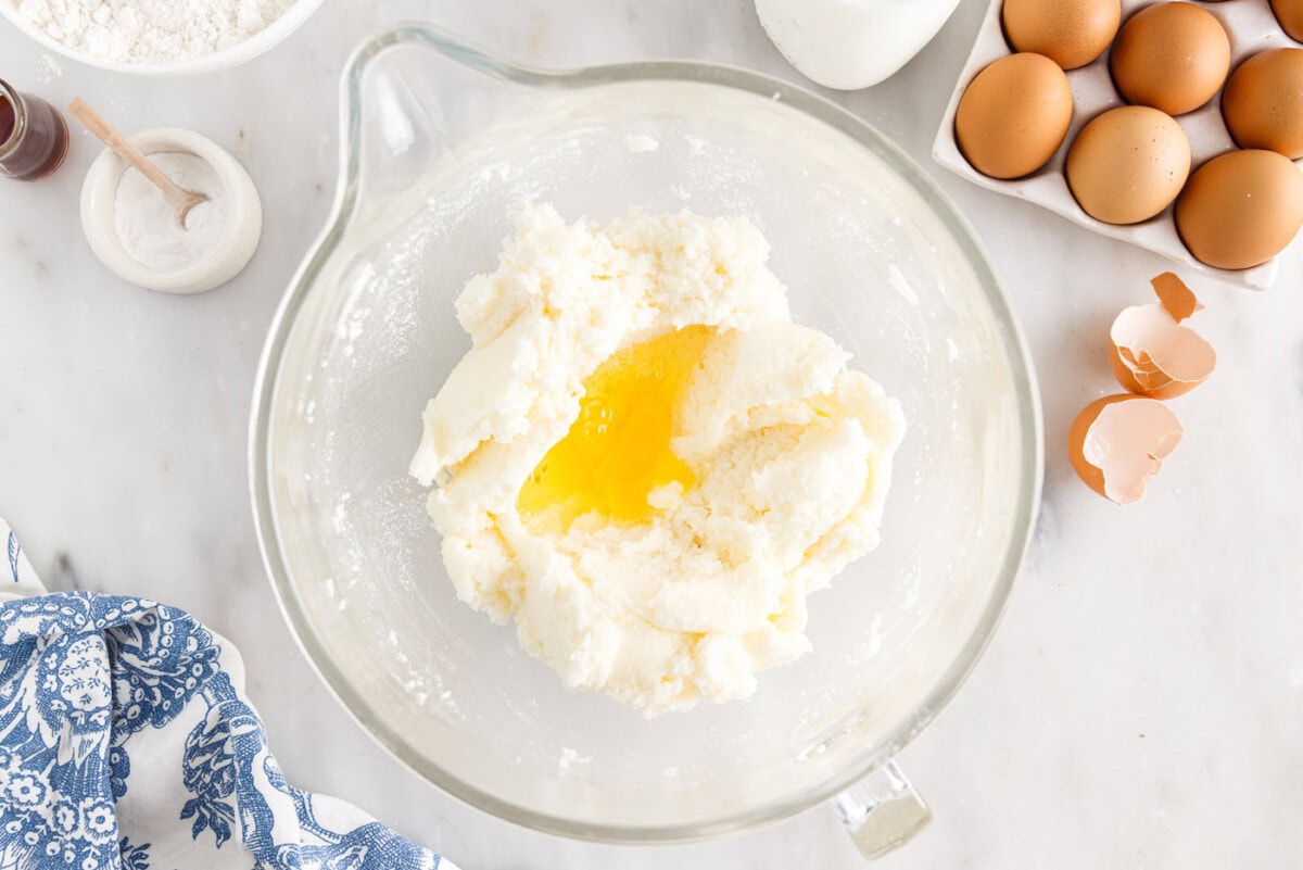 eggs added to shortening mixture in a bowl
