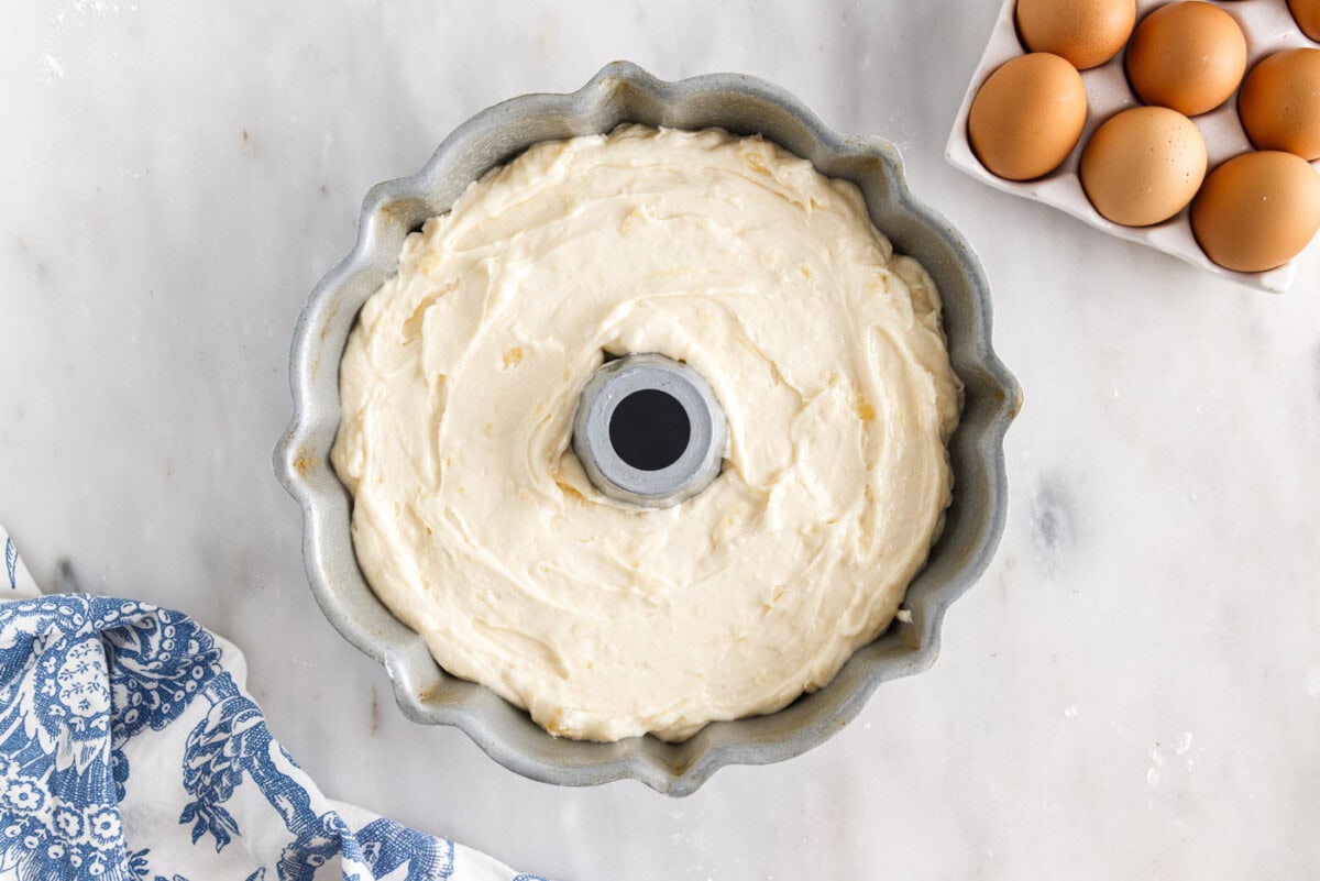 pineapple pound cake batter in a bundt pan