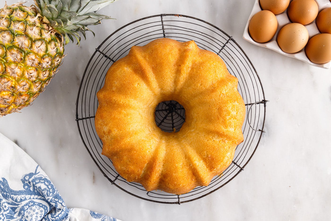 pineapple pound cake on a cooling rack