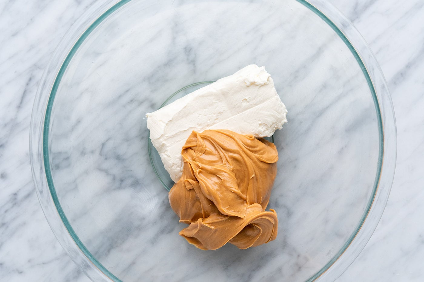 peanut butter and cream cheese in a mixing bowl