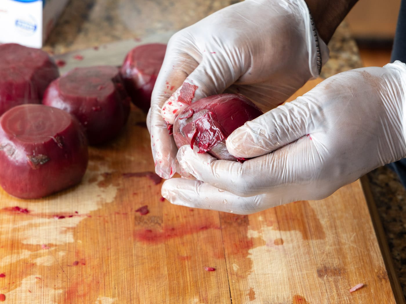 peeling skin off boiled beets