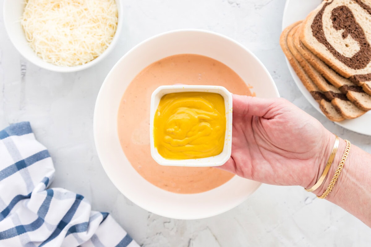 mustard over the top of thousand island dressing